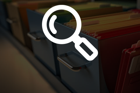 Magnifying Glass icon above a dimmed background of file folders